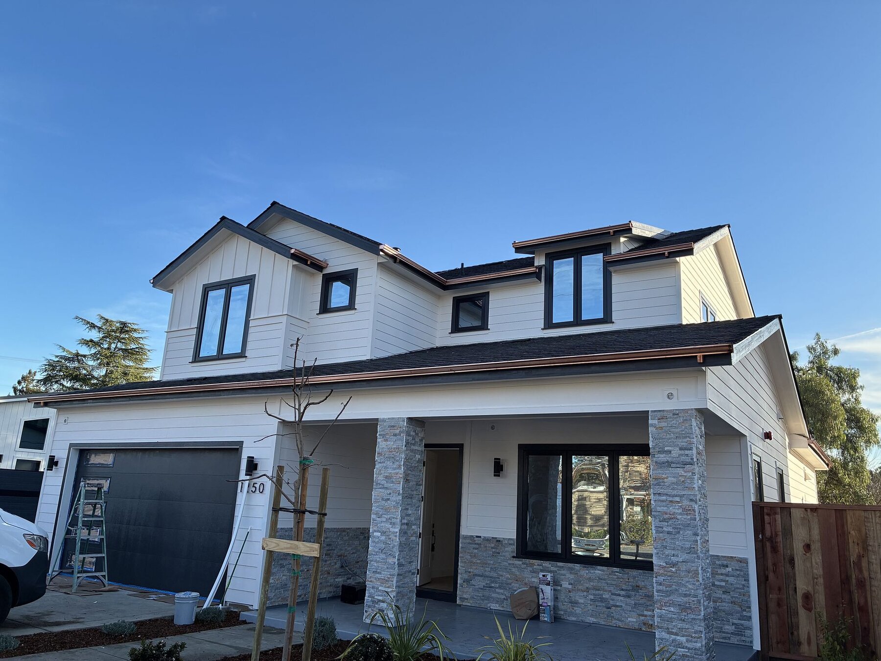 Campbell new construction modern farmhouse with copper gutters and Landmark shingles by Keith Roofing
