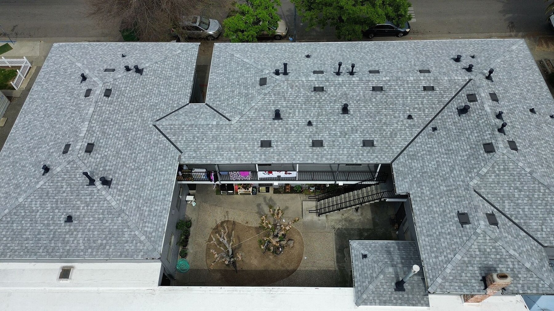 San Jose family apartment building re-roof with Landmark shingle and single-ply carport by Keith Roofing