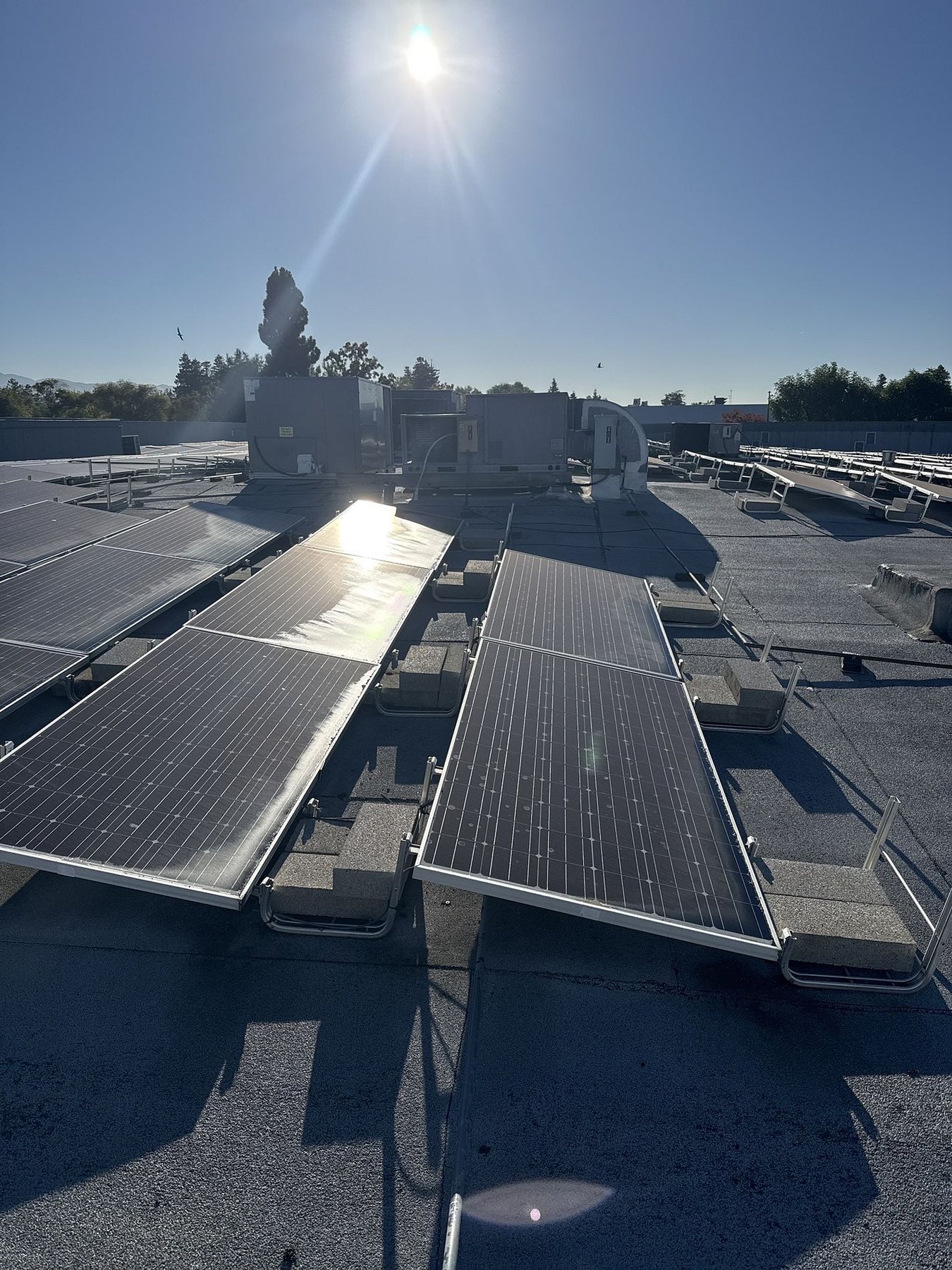 Commercial flat roof maintenance San Jose with solar array and HVAC