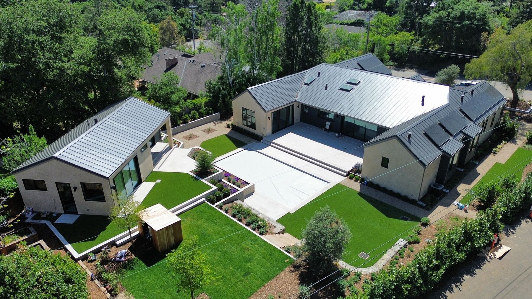 Standing seam metal roof and gutters on Los Altos Hills home and ADU by Keith Roofing