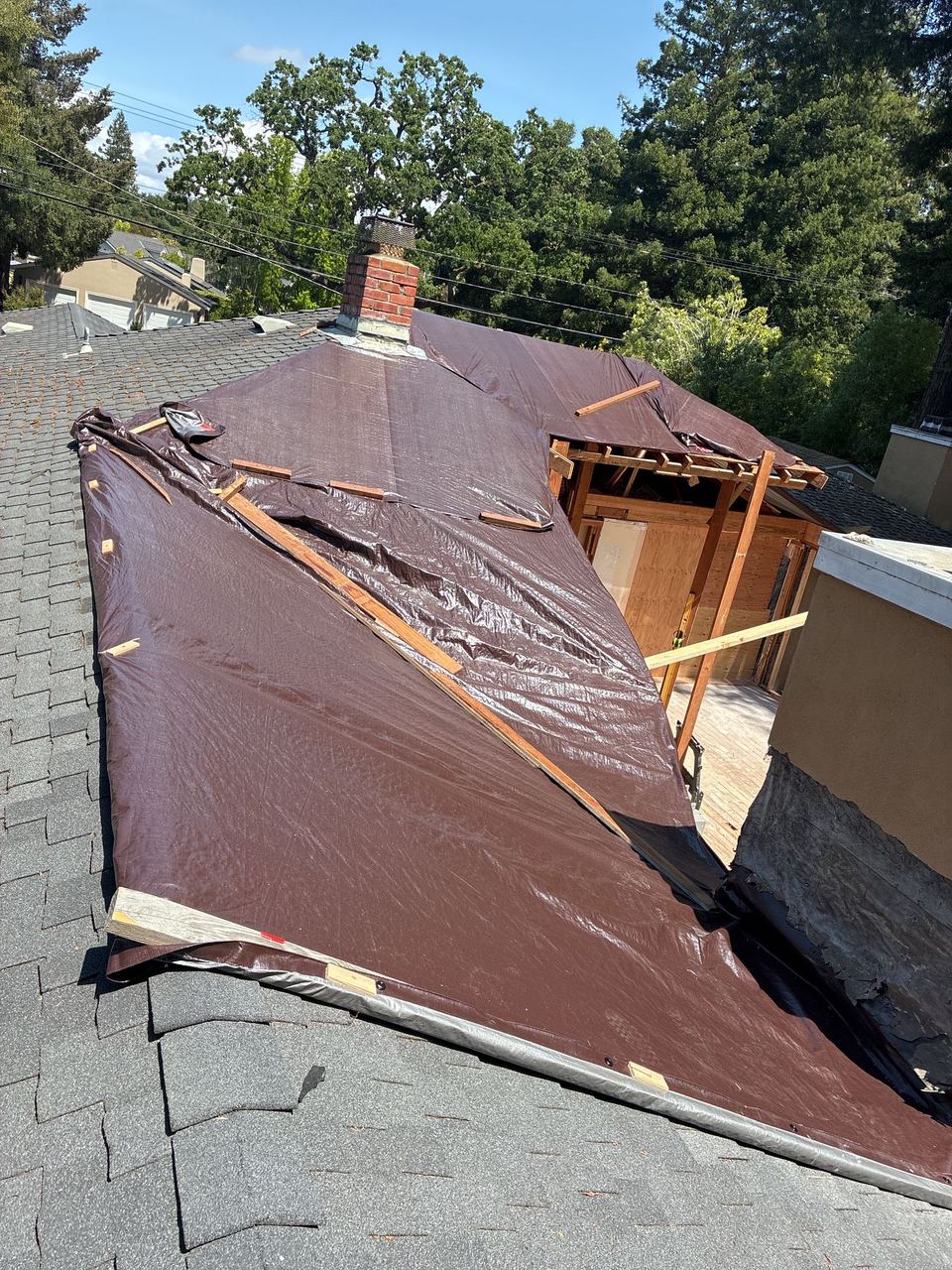 Exposed framing revealed during roof inspection after fire damage